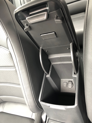 The center console bin can swallow quite a bit.